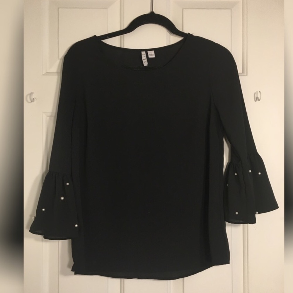 Pearl sleeved black top